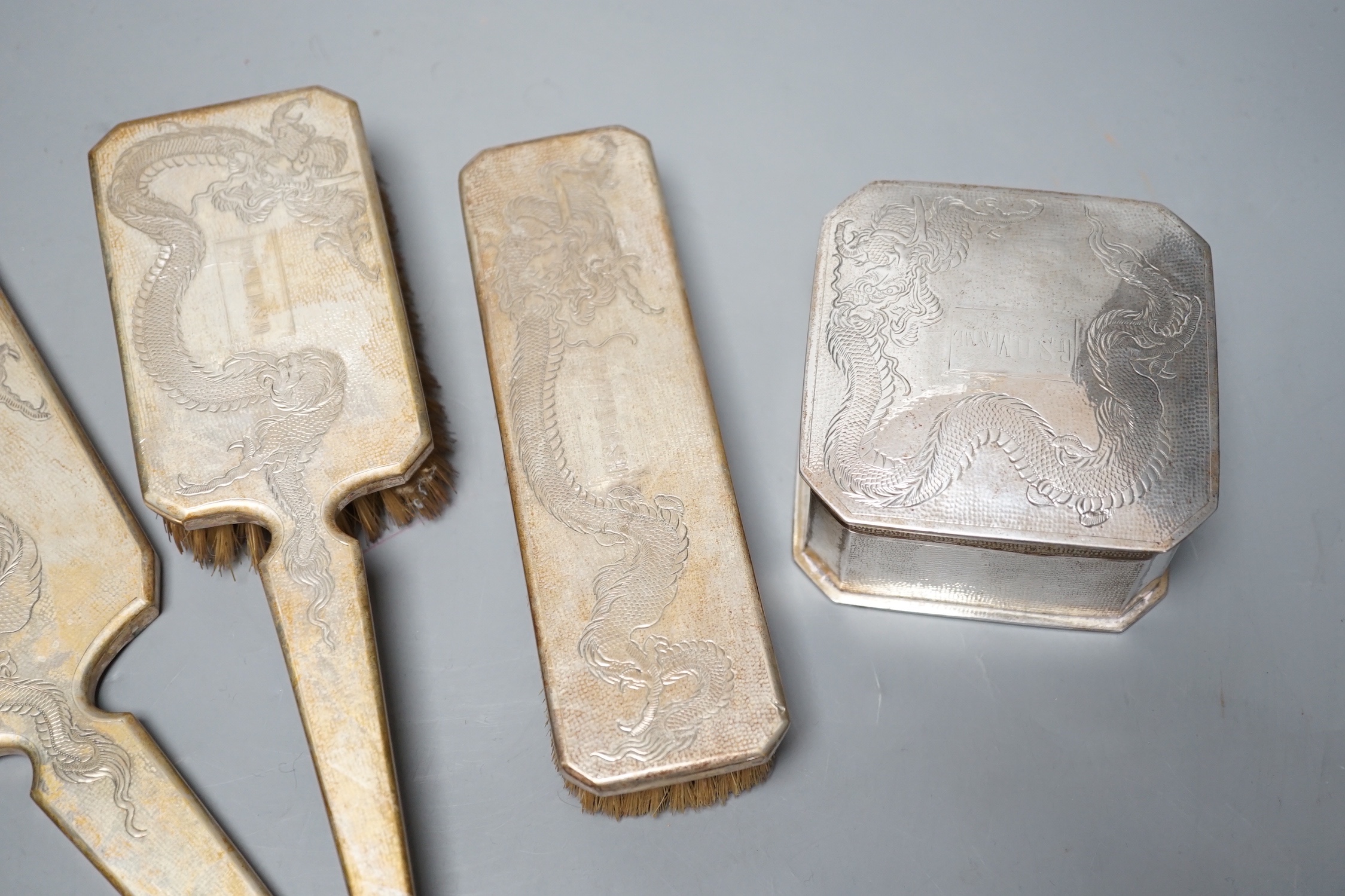 A Chinese Export engraved white metal four piece mirror, brush and box set by Nanking Store.